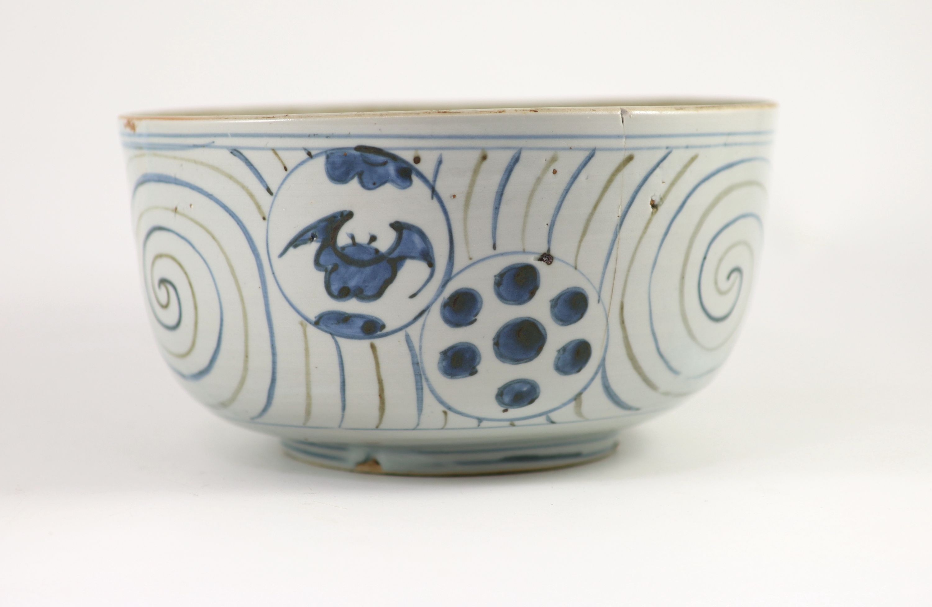 An unusual underglaze blue and iron brown bowl, probably Korean, Joseon dynasty, 18th/19th century, 23cm diameter, lacking its cover, cracked